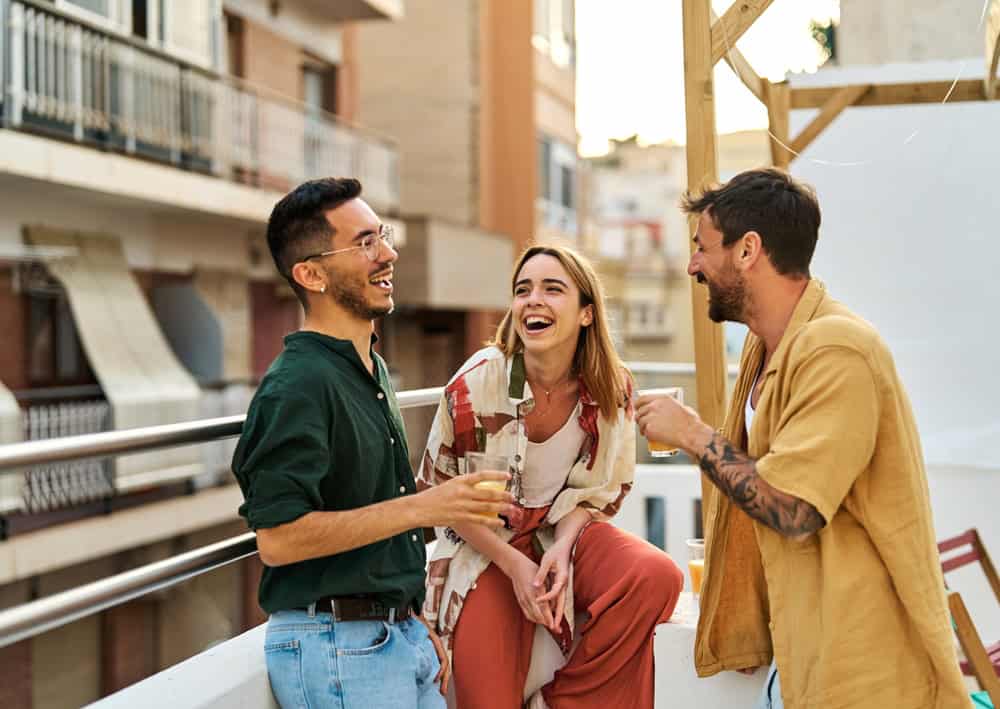 happy friends having a rooftop party